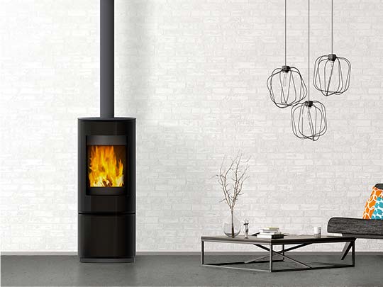 Compact black circle woodheater in contemporary grey room
