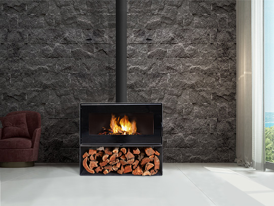 Black VisionLINE Taurus unit fireplace with grey stone wall background